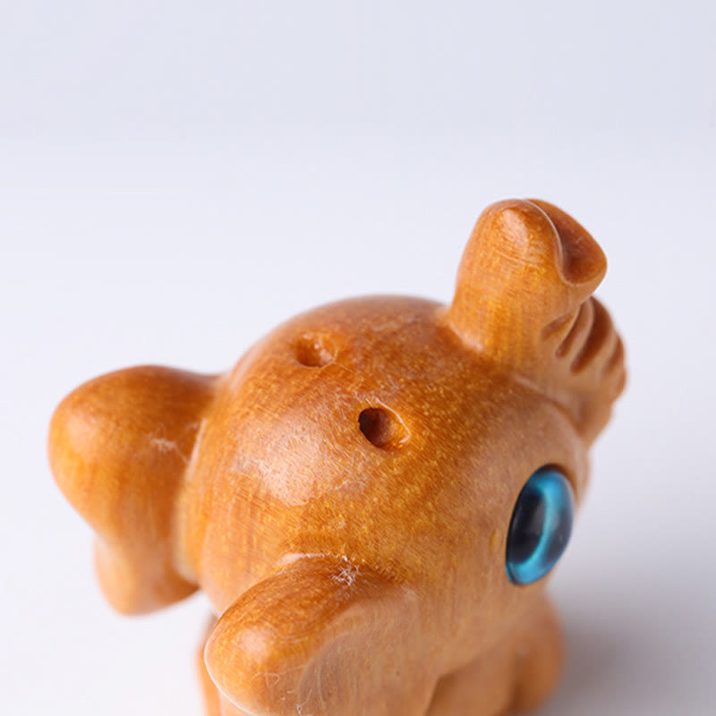 Mini éléphant sculpté en bois de santal pour la protection et la chance