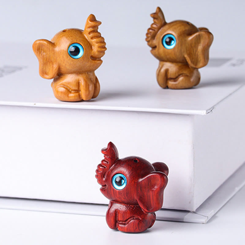 Mini éléphant sculpté en bois de santal pour la protection et la chance