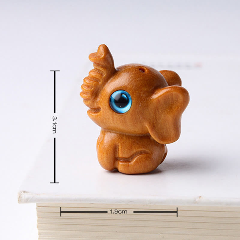 Mini éléphant sculpté en bois de santal pour la protection et la chance