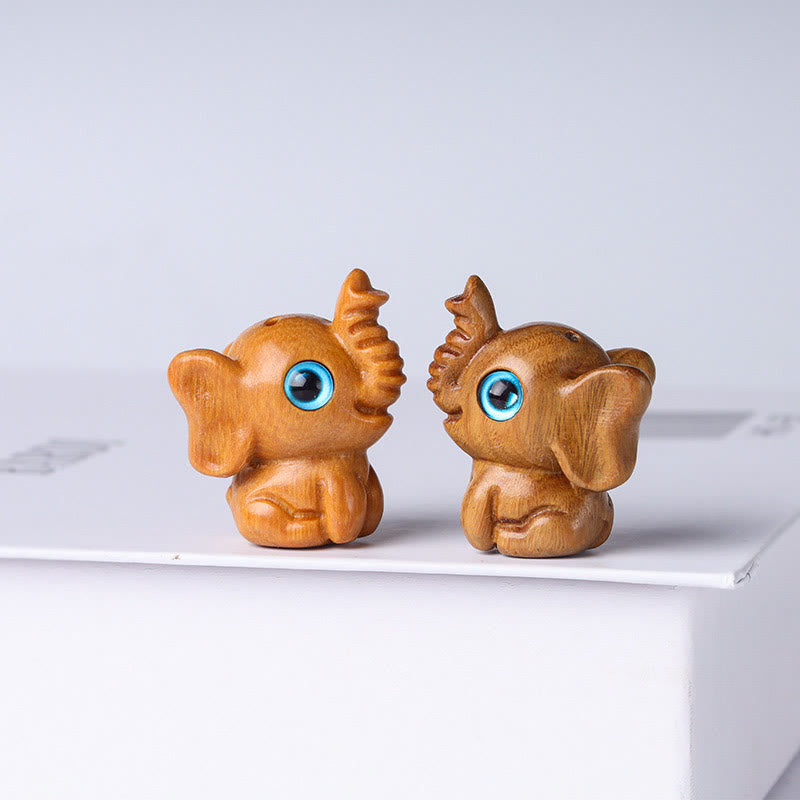 Mini éléphant sculpté en bois de santal pour la protection et la chance