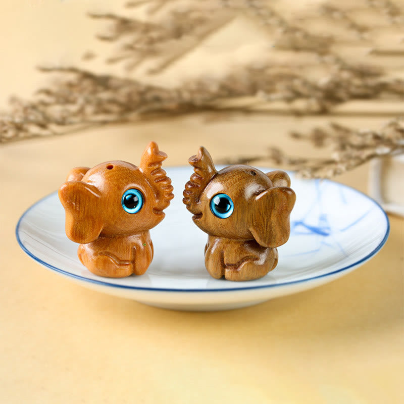 Mini éléphant sculpté en bois de santal pour la protection et la chance