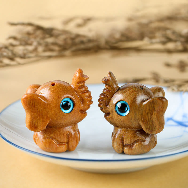Mini éléphant sculpté en bois de santal pour la protection et la chance
