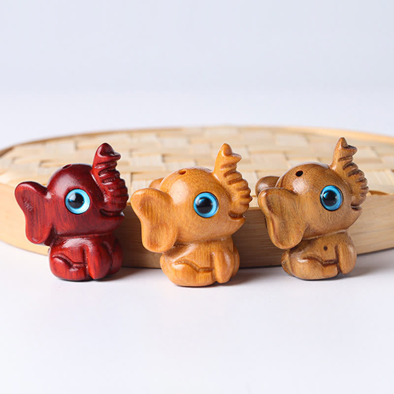 Mini éléphant sculpté en bois de santal pour la protection et la chance