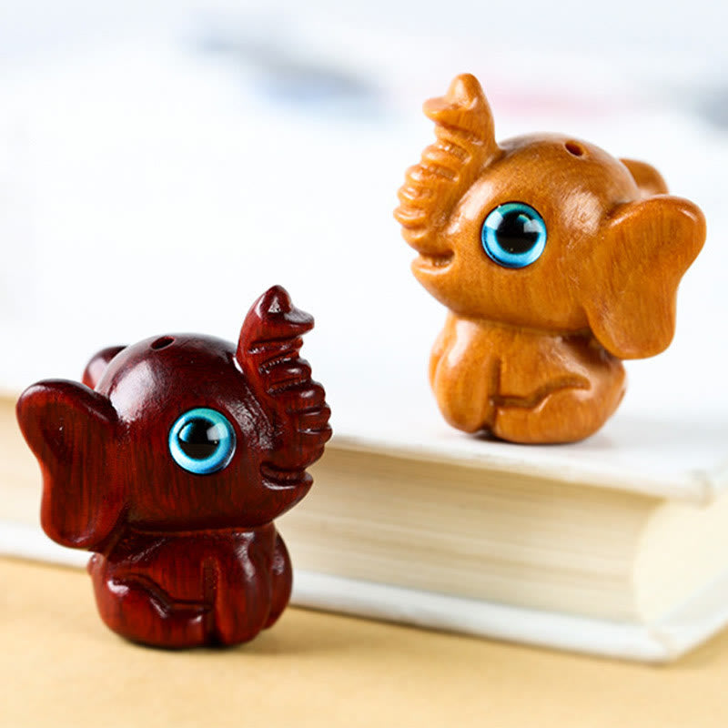 Mini éléphant sculpté en bois de santal pour la protection et la chance