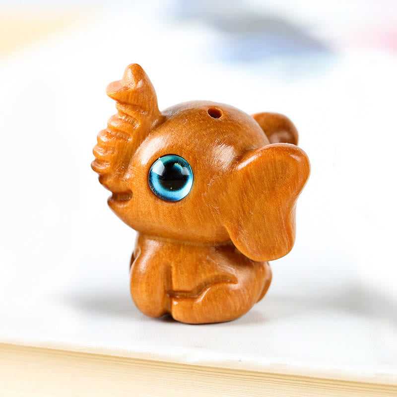 Mini éléphant sculpté en bois de santal pour la protection et la chance