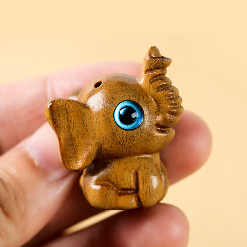 Mini éléphant sculpté en bois de santal pour la protection et la chance