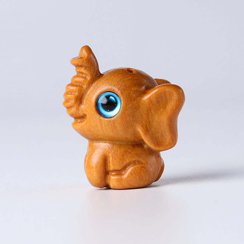 Mini éléphant sculpté en bois de santal pour la protection et la chance