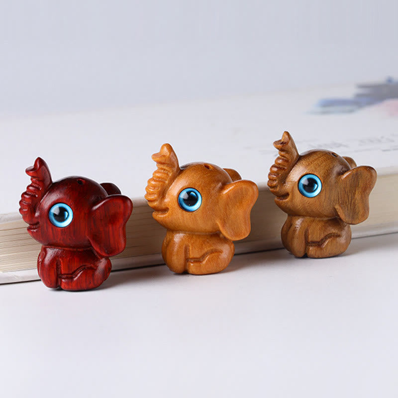 Mini éléphant sculpté en bois de santal pour la protection et la chance