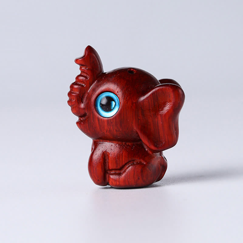 Mini éléphant sculpté en bois de santal pour la protection et la chance