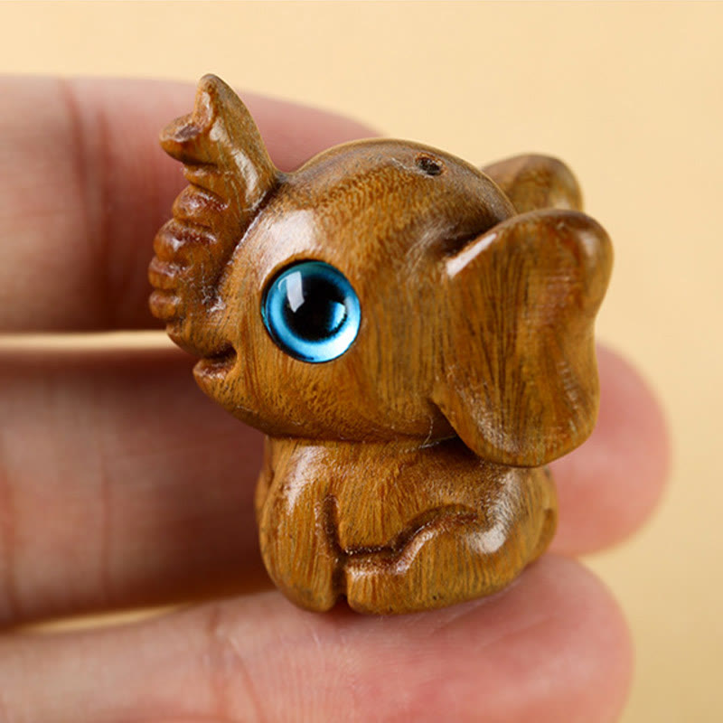 Mini éléphant sculpté en bois de santal pour la protection et la chance