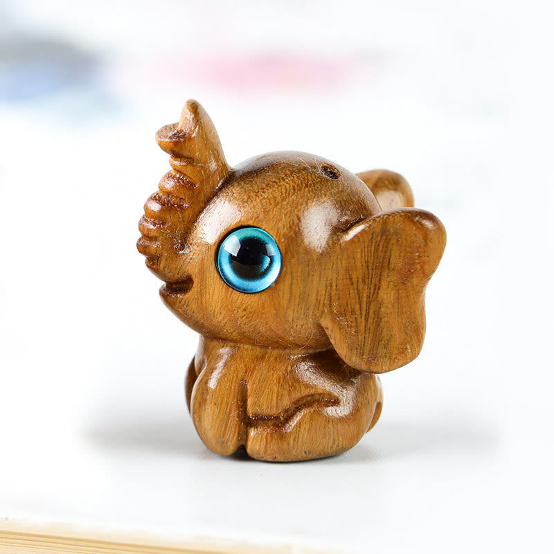 Mini éléphant sculpté en bois de santal pour la protection et la chance