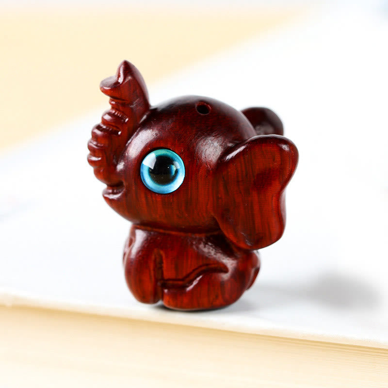 Mini éléphant sculpté en bois de santal pour la protection et la chance