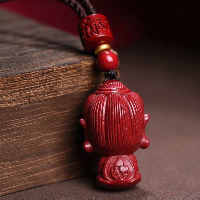 Collier du zodiaque chinois en cinabre naturel avec protection du Bouddha natal
