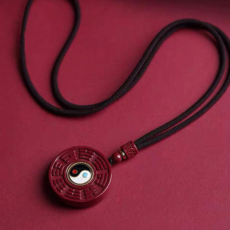 Pendentif Yin Yang en cinabre naturel pour la protection et l'équilibre