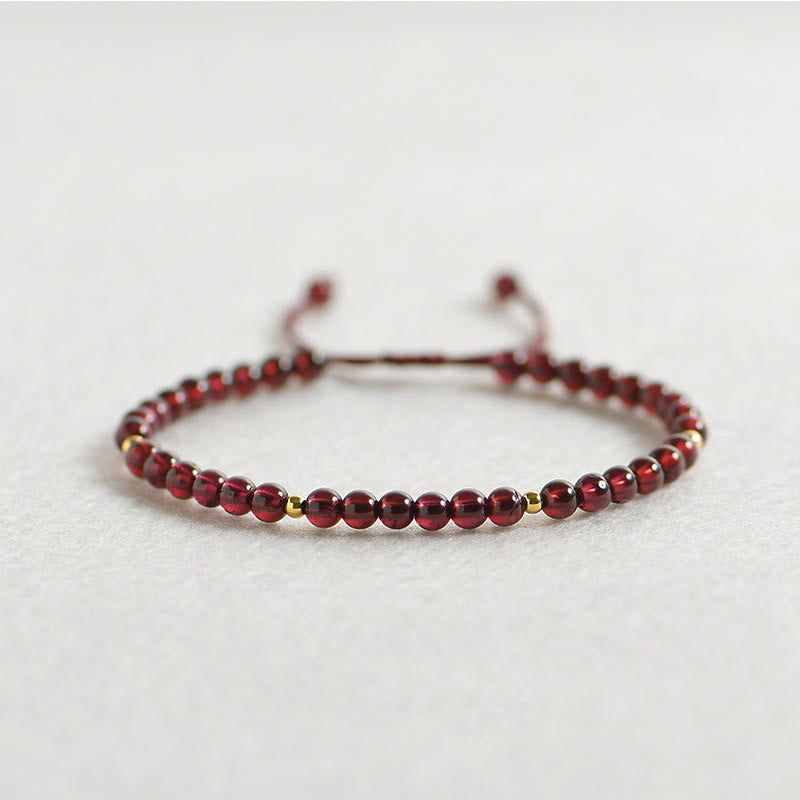 Bracelet de stabilité en perles dorées et grenat naturel