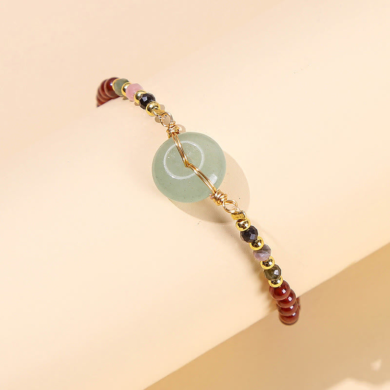 Bracelet calme en perles de grenat naturel avec boucle de paix