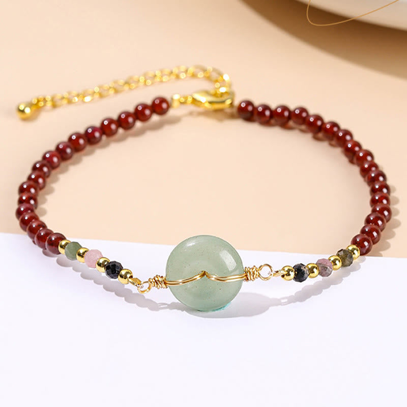 Bracelet calme en perles de grenat naturel avec boucle de paix