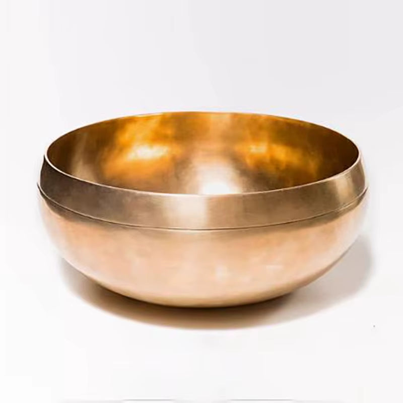 Golden metallic Nepalese Tibetan Singing Bowl for sound healing and meditation