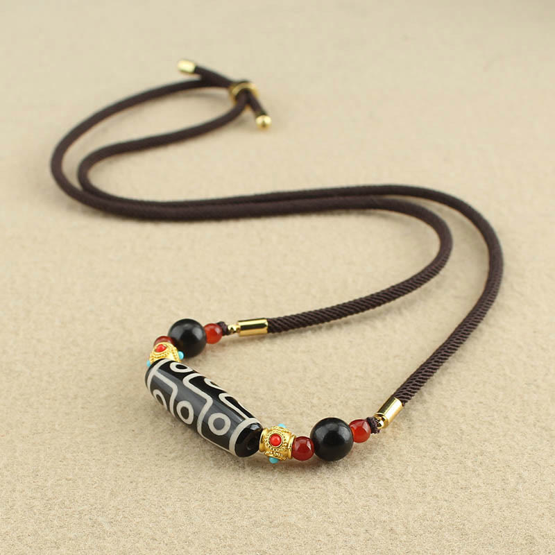 Collier de protection en perles dzi à neuf yeux | Pendentif en agate tibétaine