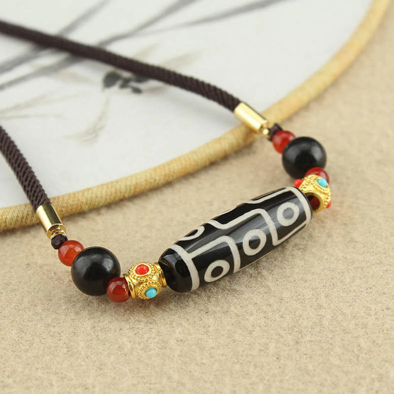 Collier de protection en perles dzi à neuf yeux | Pendentif en agate tibétaine
