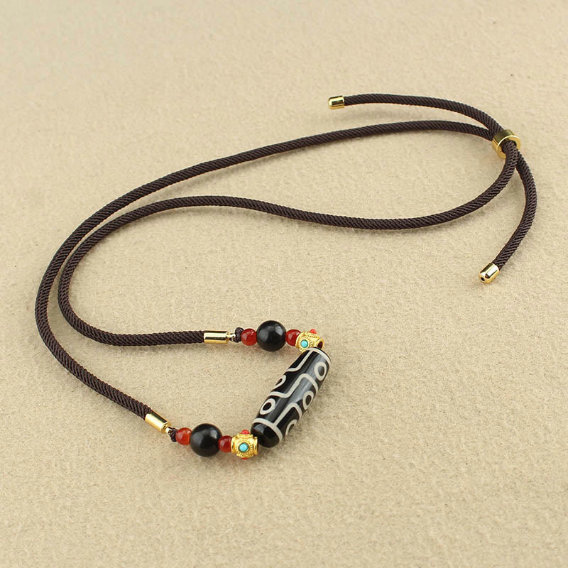 Collier de protection en perles dzi à neuf yeux | Pendentif en agate tibétaine