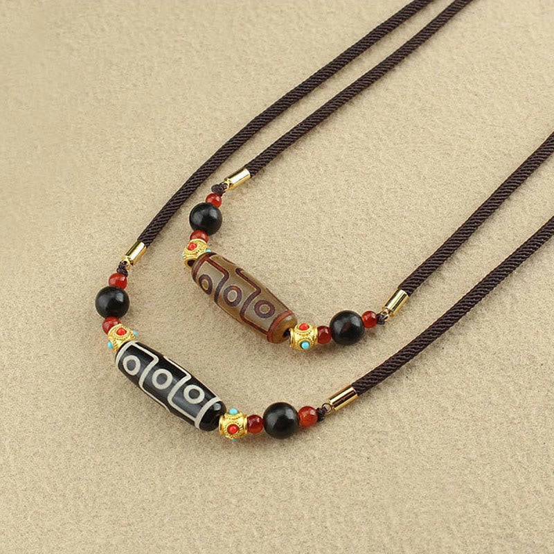 Collier de protection en perles dzi à neuf yeux | Pendentif en agate tibétaine