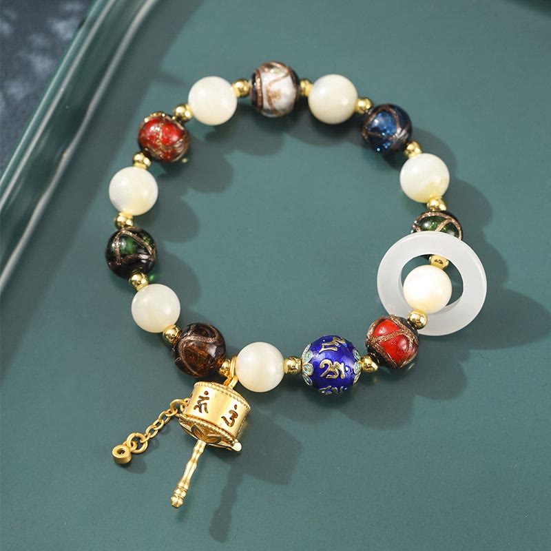 Bracelet Om Mani Padme Hum Om avec Tridacna et pierres de soleil 14-16 cm