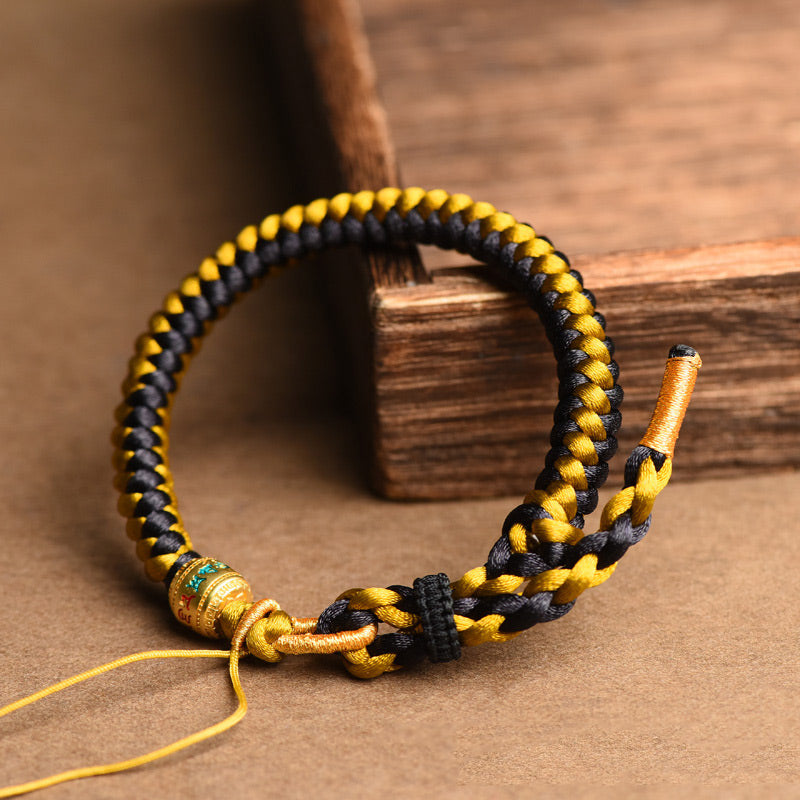 Bracelet en corde noire et or tibétain Om Mani Padme Hum