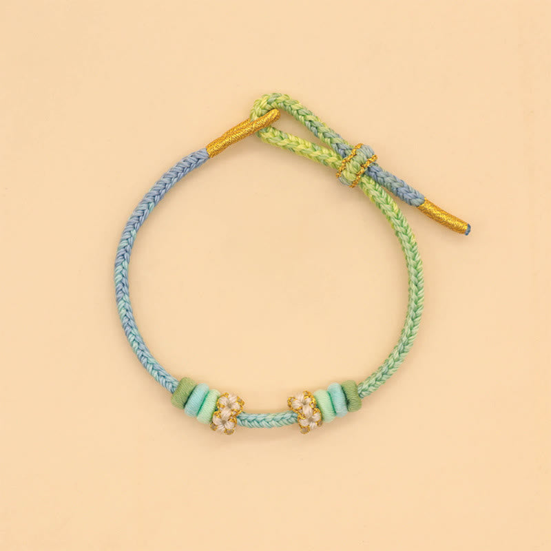 Bracelet à huit fils rouges Peace Knot pour la chance et l'harmonie