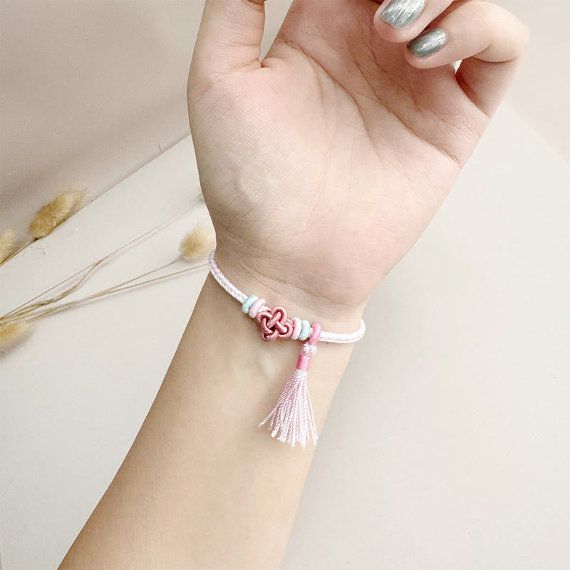 Bracelet de protection coloré en fil de fleur de pêcher pour l'harmonie