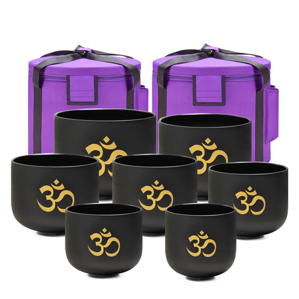 Set of black singing bowls with gold Om symbols and purple carrying cases for Perfect Pitch