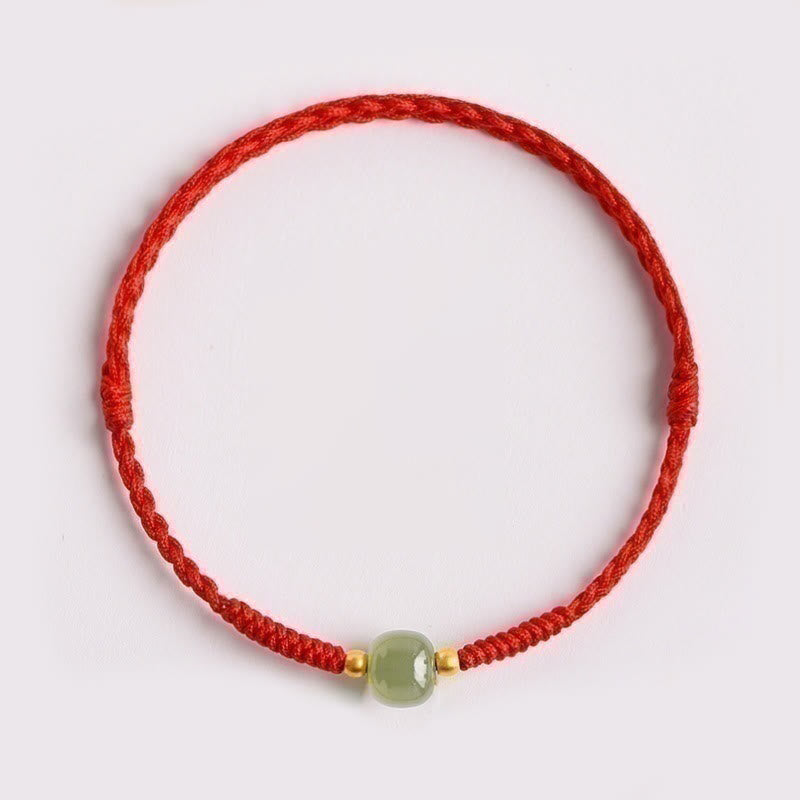 Bracelet de perles de jade de prospérité avec cordon rouge tressé