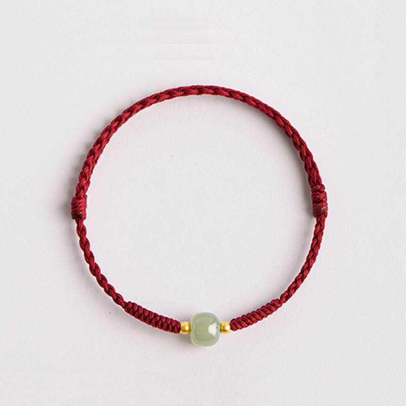 Bracelet de perles de jade de prospérité avec cordon rouge tressé