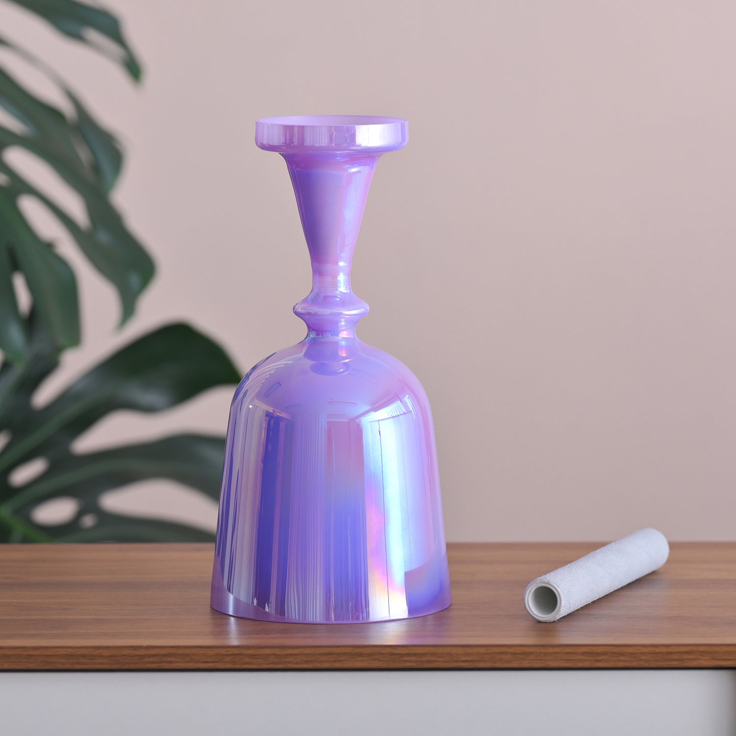 Iridescent purple glass vase and white object for the Purple Crystal Singing Chalice