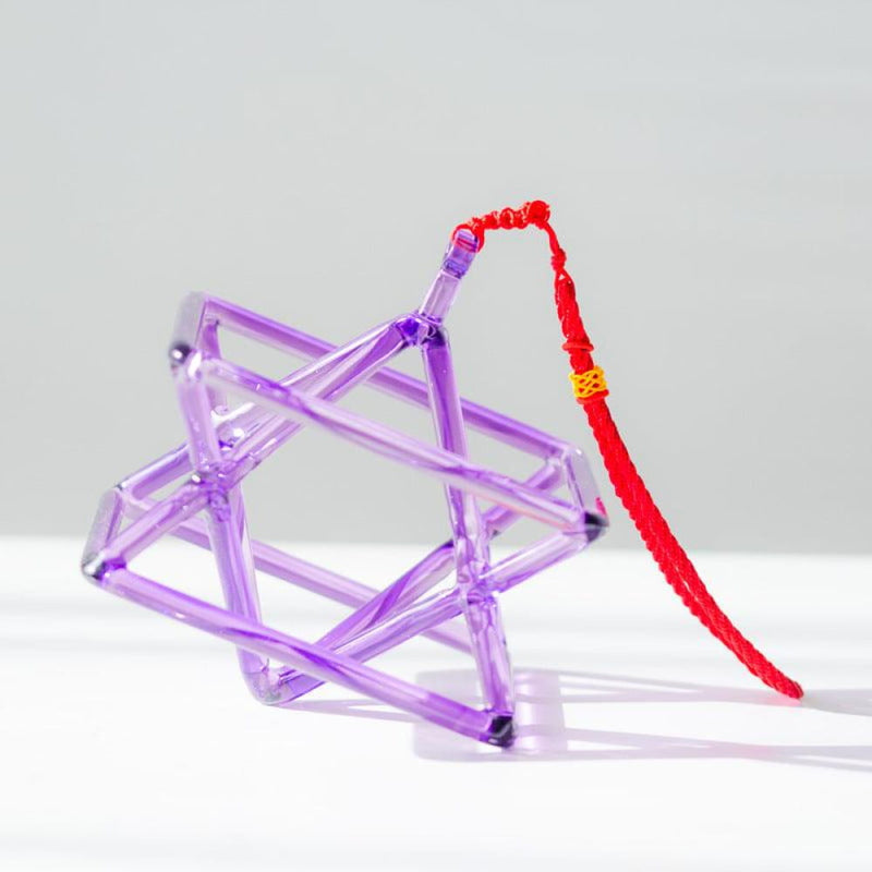 Purple geometric sculpture with red string in Purple Quartz Merkaba Pyramid product