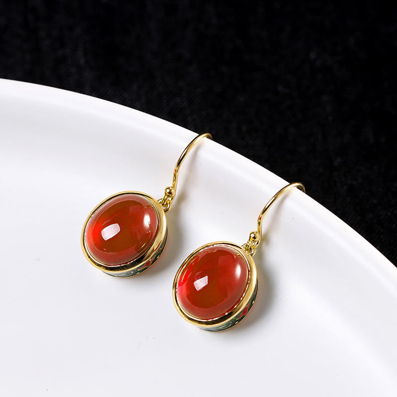 Boucles d'oreilles spirituelles en corindon rouge pour la confiance et le courage