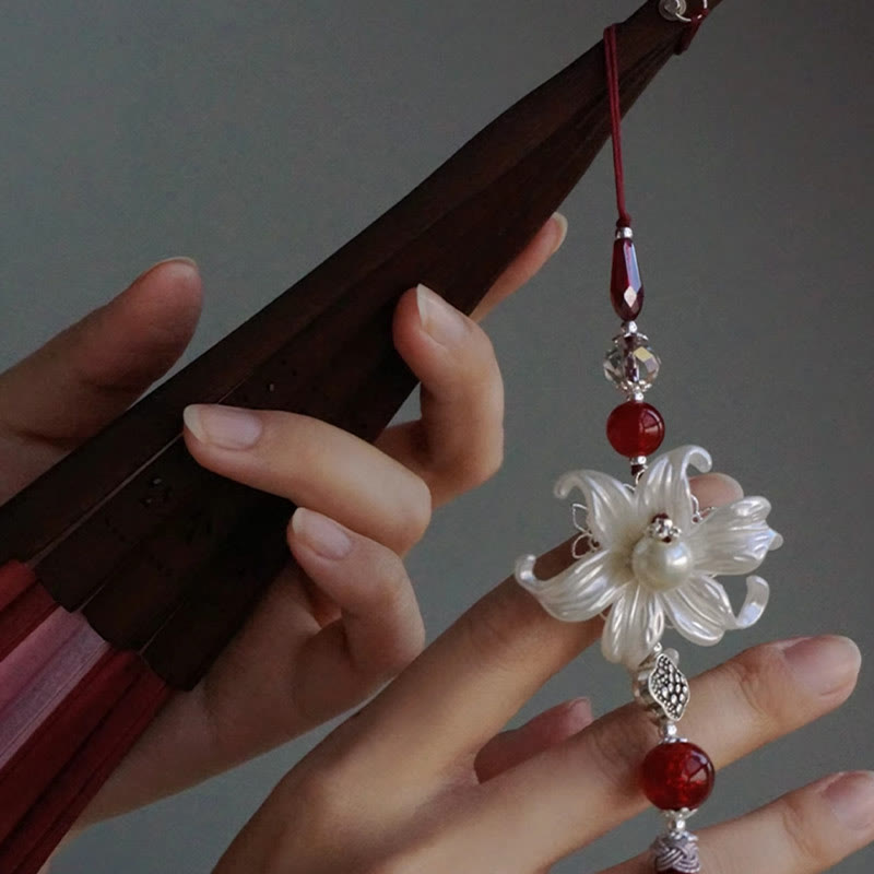 Éventail chinois pliant en bambou et soie Red Lily 22 cm