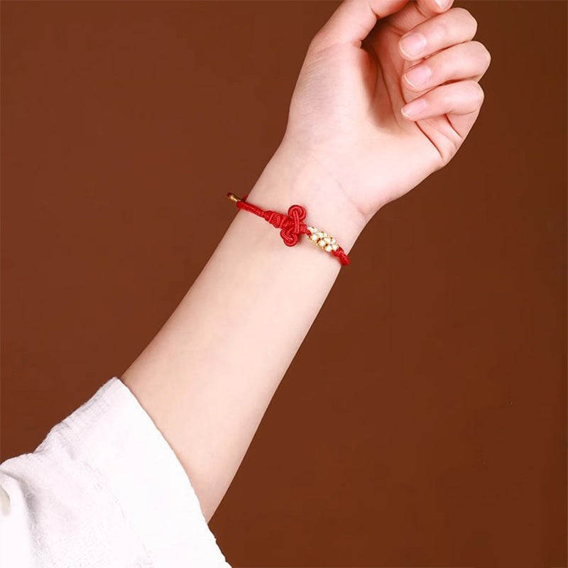 Bracelet fil rouge avec nœud Wenchang | Chance et force