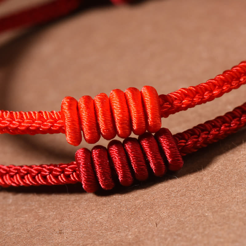 Bracelet de force à huit brins en corde rouge