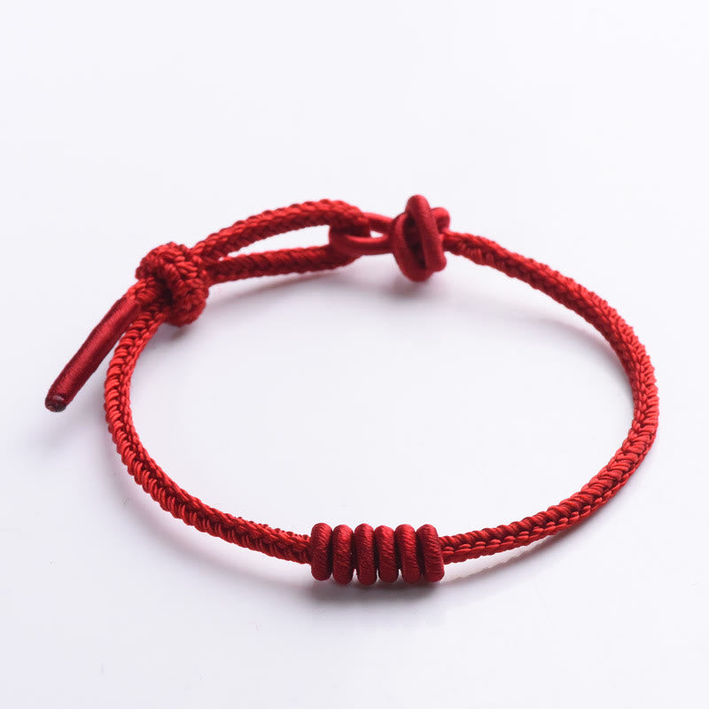 Bracelet de force à huit brins en corde rouge