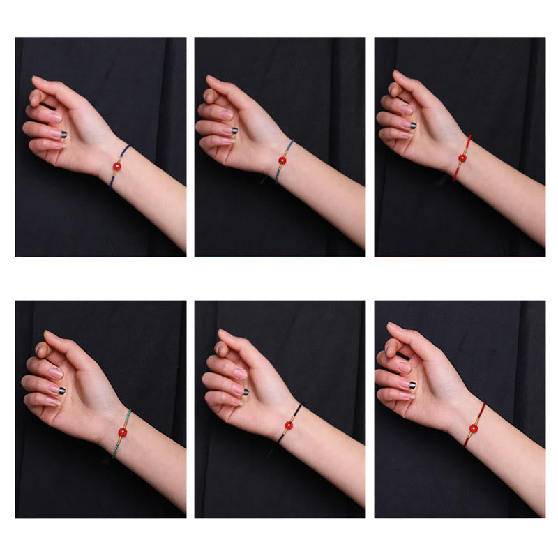 Bracelet de protection en fil rouge avec fleur dorée