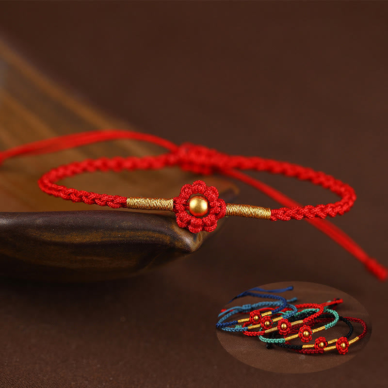 Bracelet de protection en fil rouge avec fleur dorée