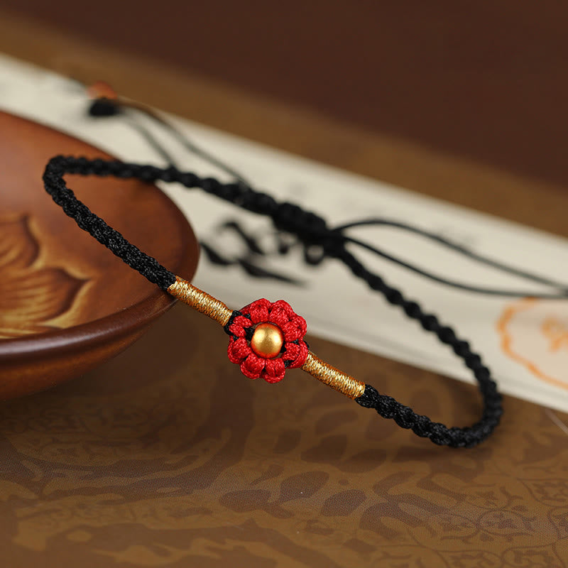 Bracelet de protection en fil rouge avec fleur dorée