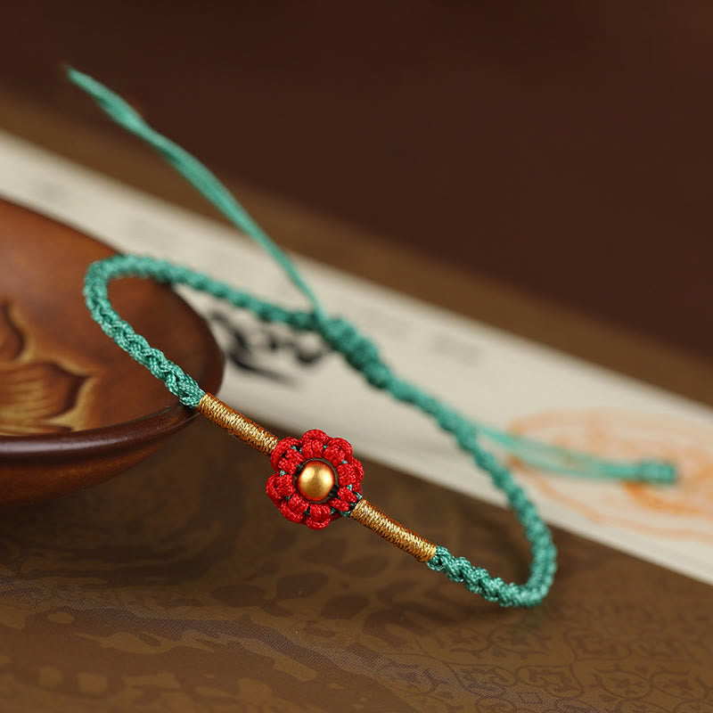 Bracelet de protection en fil rouge avec fleur dorée