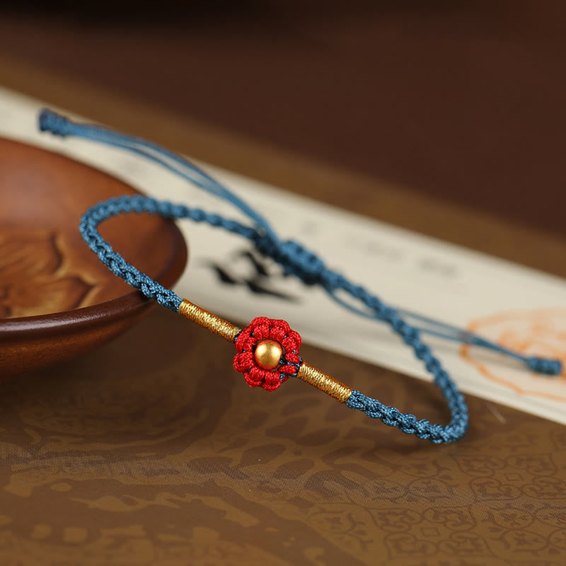 Bracelet de protection en fil rouge avec fleur dorée