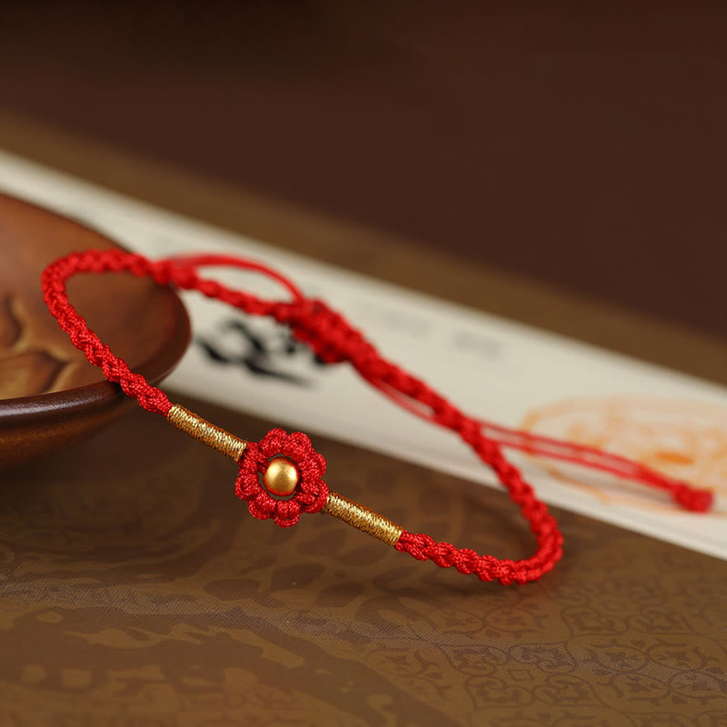 Bracelet de protection en fil rouge avec fleur dorée