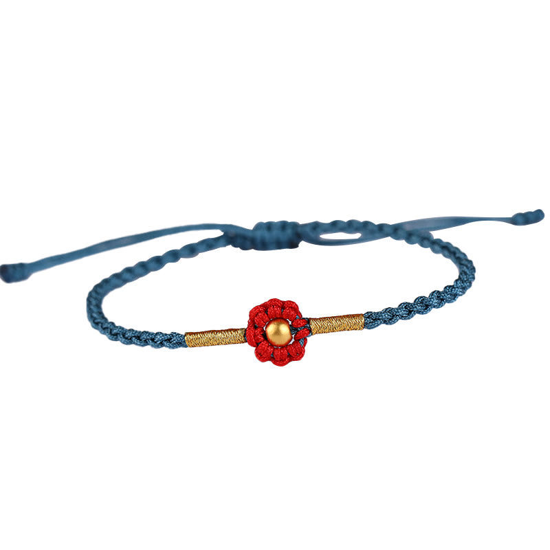 Bracelet de protection en fil rouge avec fleur dorée