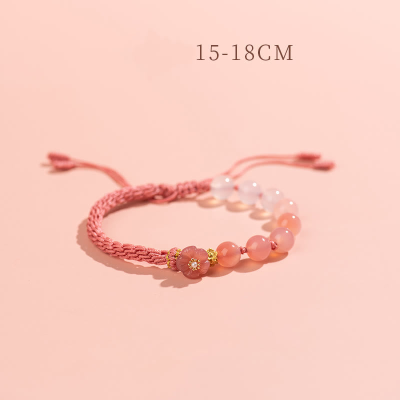 Bracelet en agate à nœud de réincarnation avec breloque en fleur de pêcher