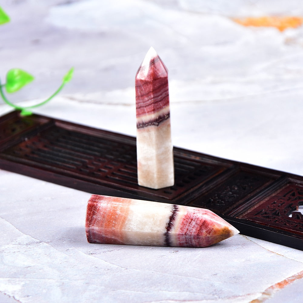 Tour de cristal de rhodochrosite pour l'équilibre émotionnel