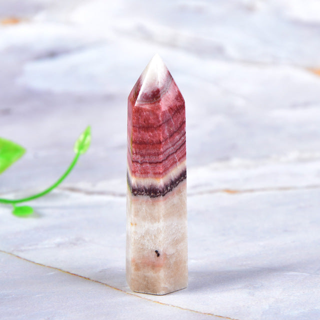 Tour de cristal de rhodochrosite pour l'équilibre émotionnel